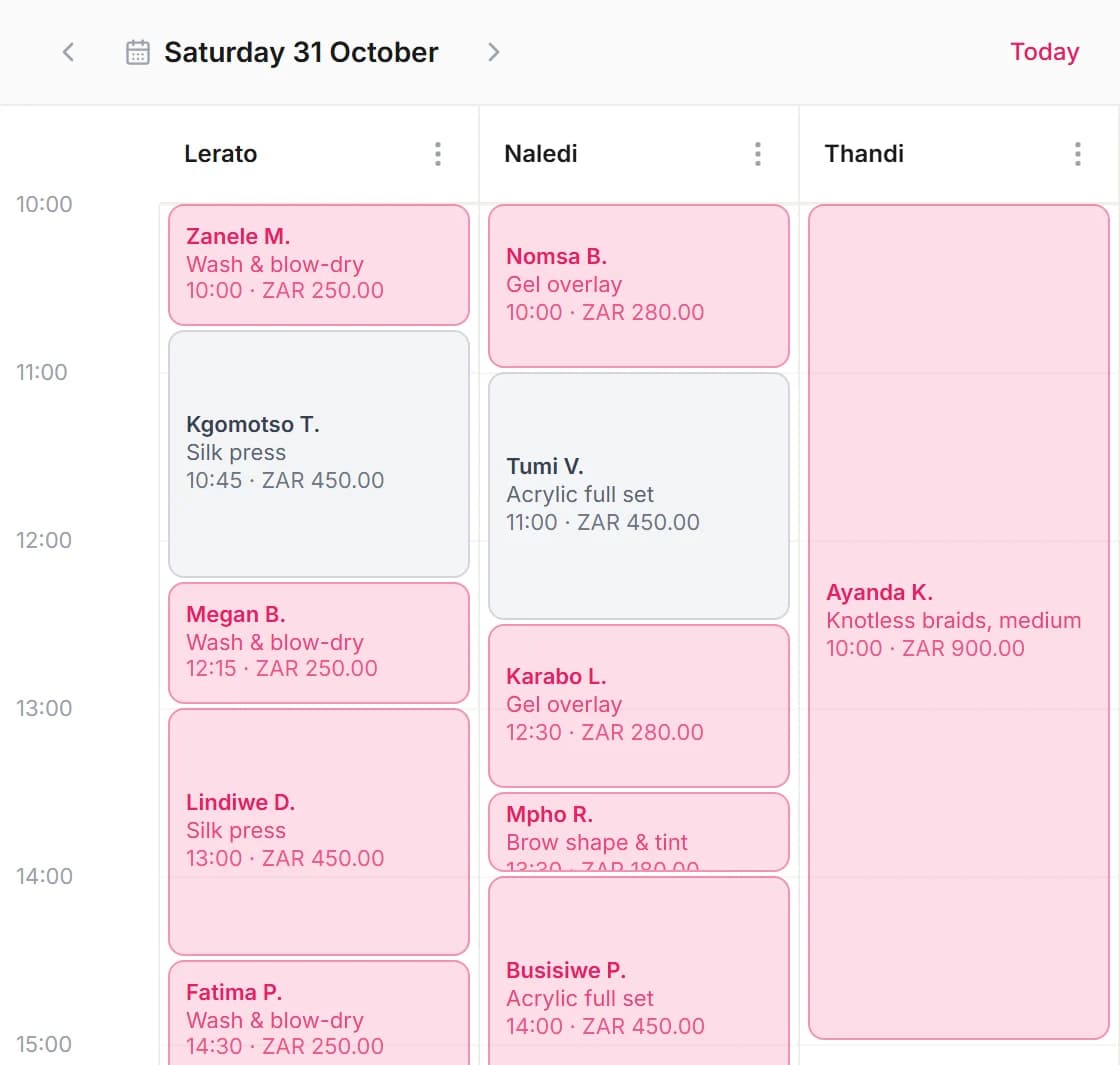 The Saturday diary of Jacaranda Hair & Nails in Blyssbook, with a column per team member and the client, service and rand price in each booking, including a five-hour knotless braids slot.